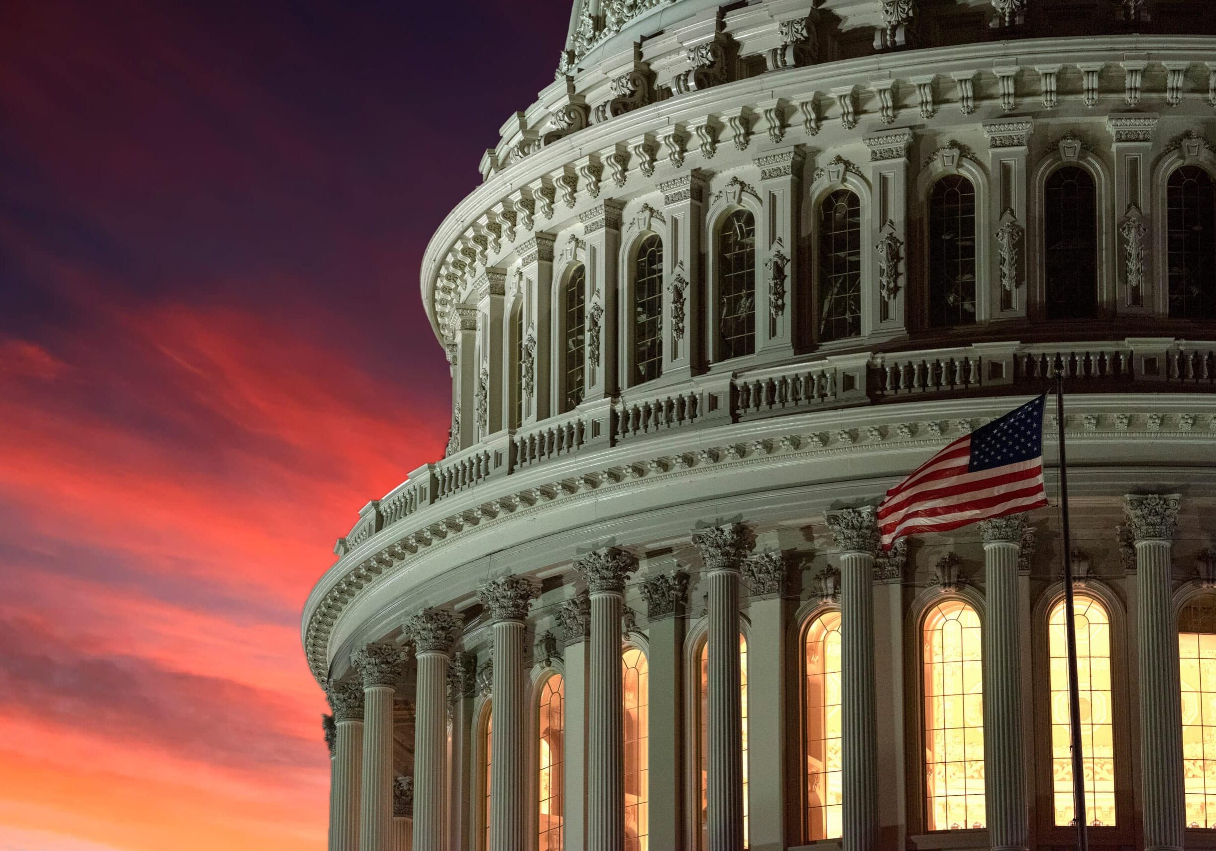 washington dc capitol at night on dramatic red sunset background